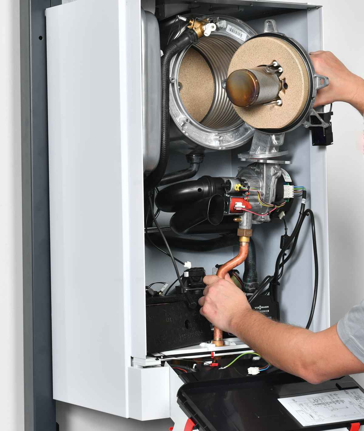 Photo of an engineer carrying out maintenance on a Viessmann boiler